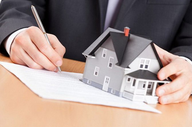 Business man signing documents for a house